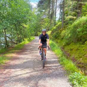 Male gravel riding in Scotland on a cycling tour